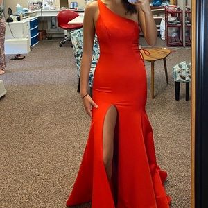 This dress is called Morilee by Madeline Garner in Red.